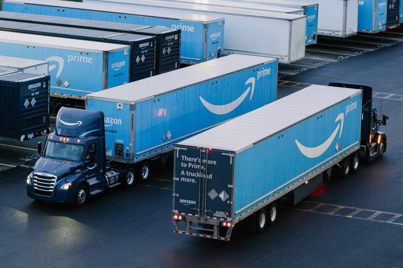 Two trucks driving in opposite directions.